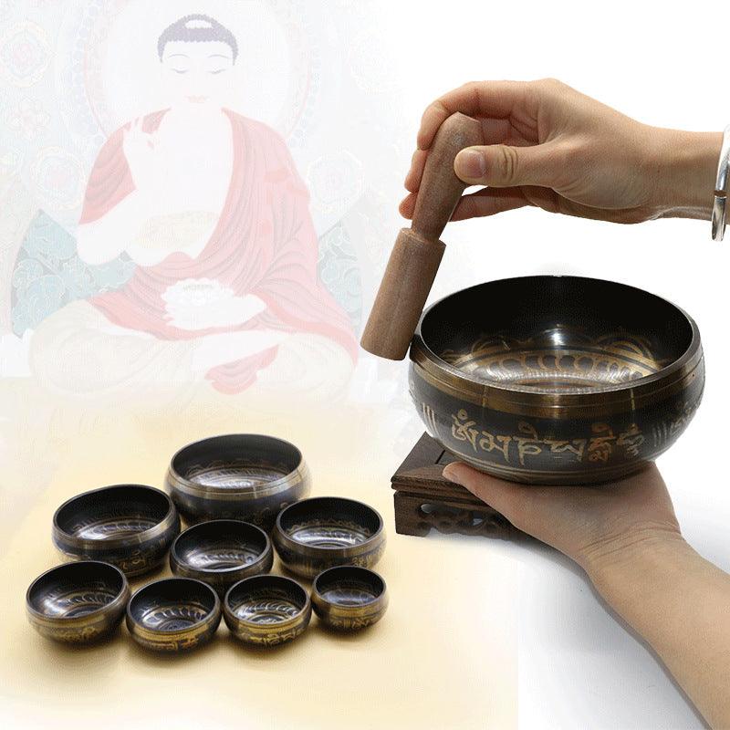 Close-up of the bowl's rim, highlighting the smooth craftsmanship and traditional Tibetan script in gold.